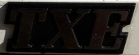 7700773023 - Emblema "TXE" (Phase 1) Guarda lamas trás