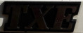 7700773023 - Emblema "TXE" (Phase 1) Guarda lamas trás